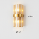 Gold LED designer wall light with cascading crystal glass