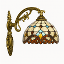 Rustic and antique wall light with Tiffany stained glass
