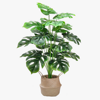 Artificial monstera and palm leaves for decoration