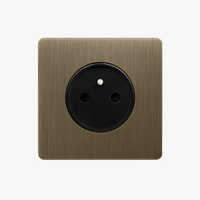 Brushed grey steel electric socket with rounded edges