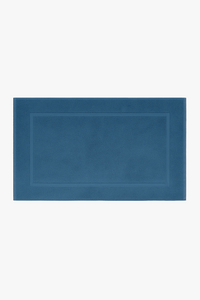 Thick cotton bath mat with textured finish, machine washable