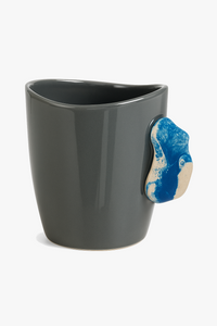 Creative ceramic mug with climbing-style handle