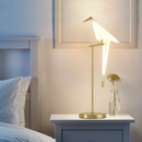 Table lamp shaped like a bird on a golden branch