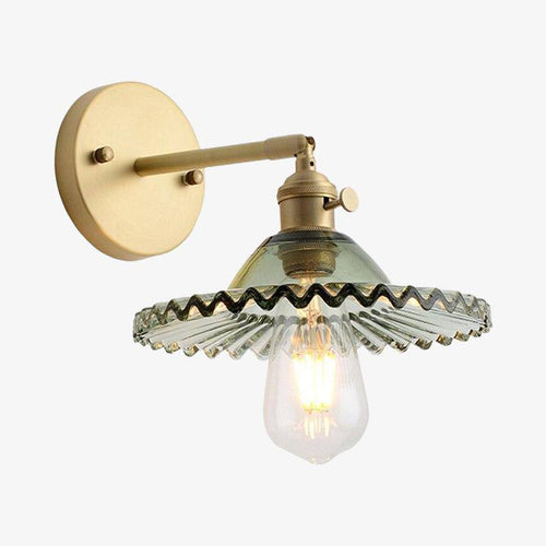 Gold wall light with coloured glass shade