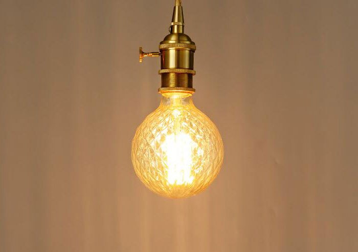 Distorted globe bulb with vintage filament incandescent 40W Edison