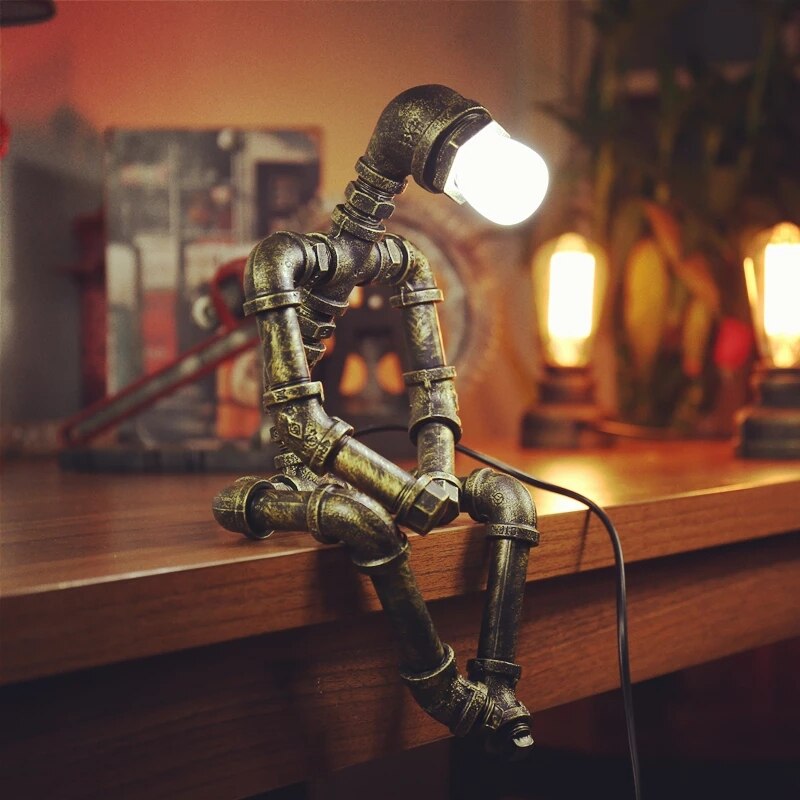 Industrial LED table lamp metallic robot figure Nile