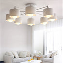 Modern ceiling light with multiple conical fabric shades romero