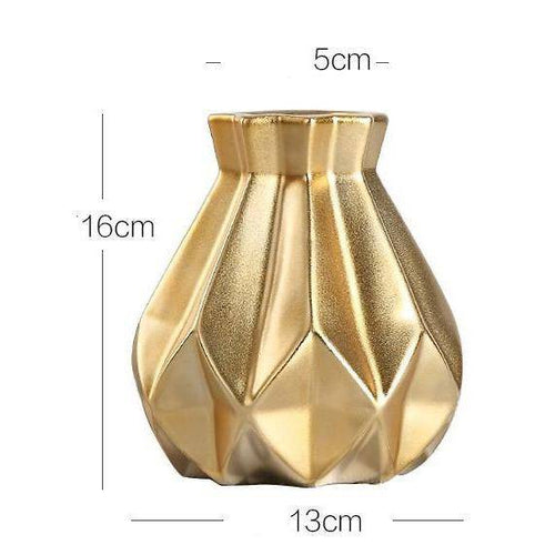 Designer vase in gold metal with geometric shapes Luxury
