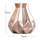 Designer vase in gold metal with geometric shapes Luxury