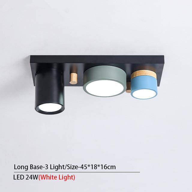Designer ceiling light with several colored cylindrical LED spots