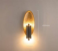 Design LED wall light with rounded metal backplate and gold tube Rui