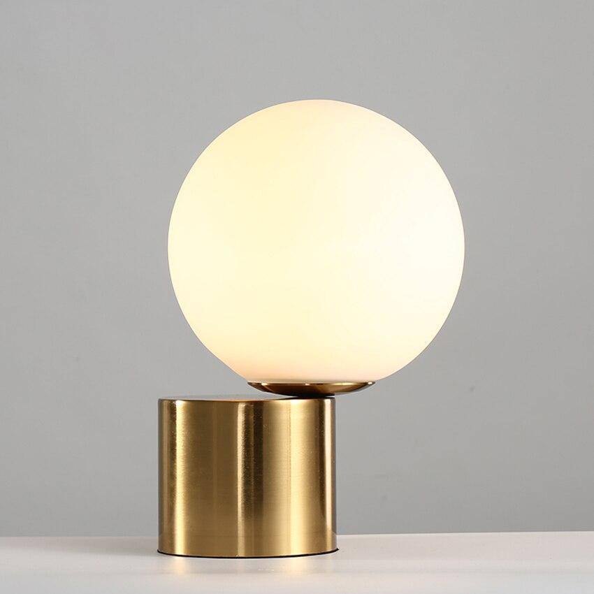 Modern bedside lamp with gold base and glass globe - vue 6 sur 8