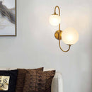 Modern LED wall light with double glass globe and gold base
