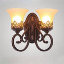 Rustic retro metal wall light with glass shade