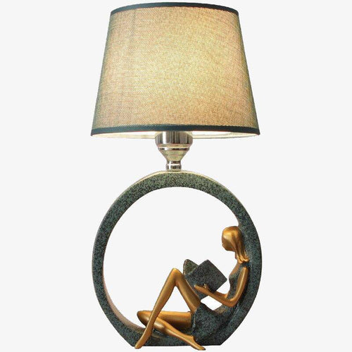 LED table lamp with sculpted body and fabric shade