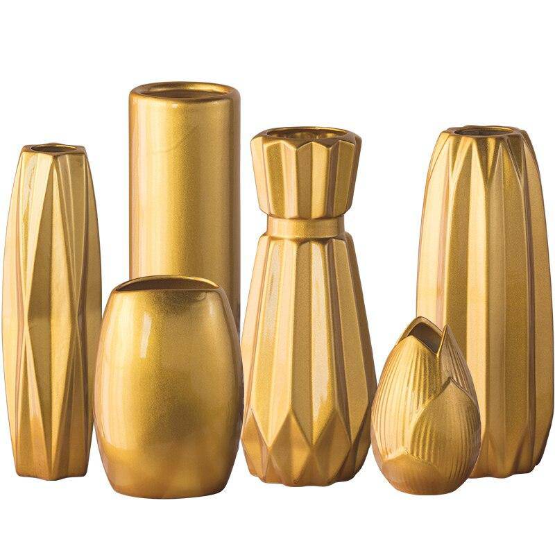 Designer vase in golden ceramic with a geometric style