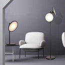 Modern LED floor lamp in black metal with large luminous circle nordic
