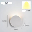 Design LED wall light with curved metal tile