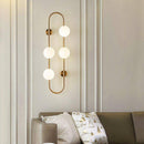 Modern LED wall light with metal ring and glass globe