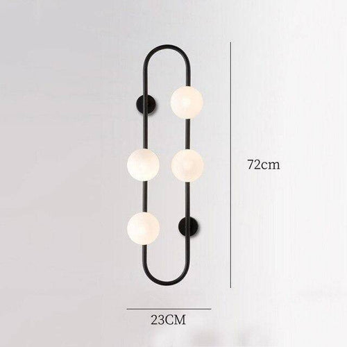 Modern LED wall light with metal ring and glass globe