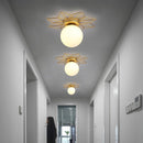 Modern LED ceiling light with metallic sun and Sana globe