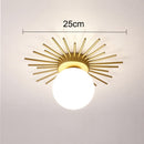 Modern LED ceiling light with metallic sun and Sana globe
