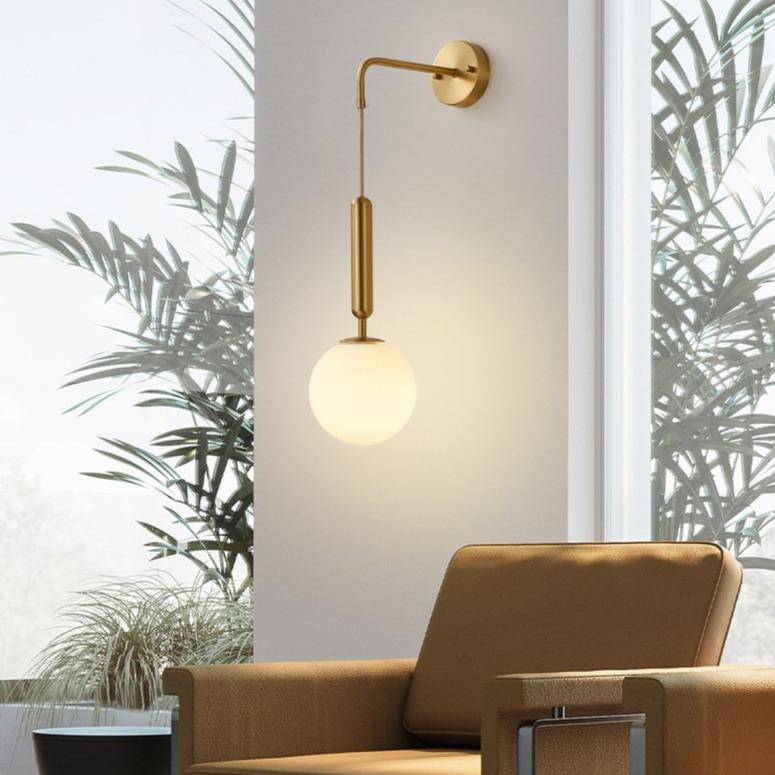 Gold design LED wall light with glass globe Shadow