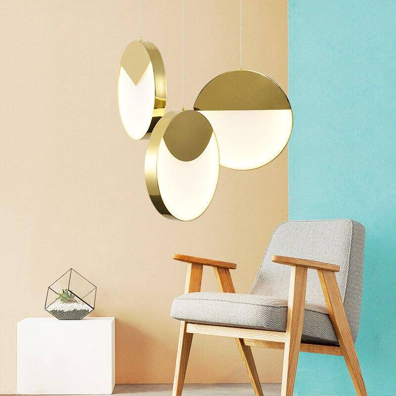Designer LED pendant light with thick gold-edged disc