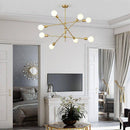 Designer LED chandelier in gold metal and glass globes Light