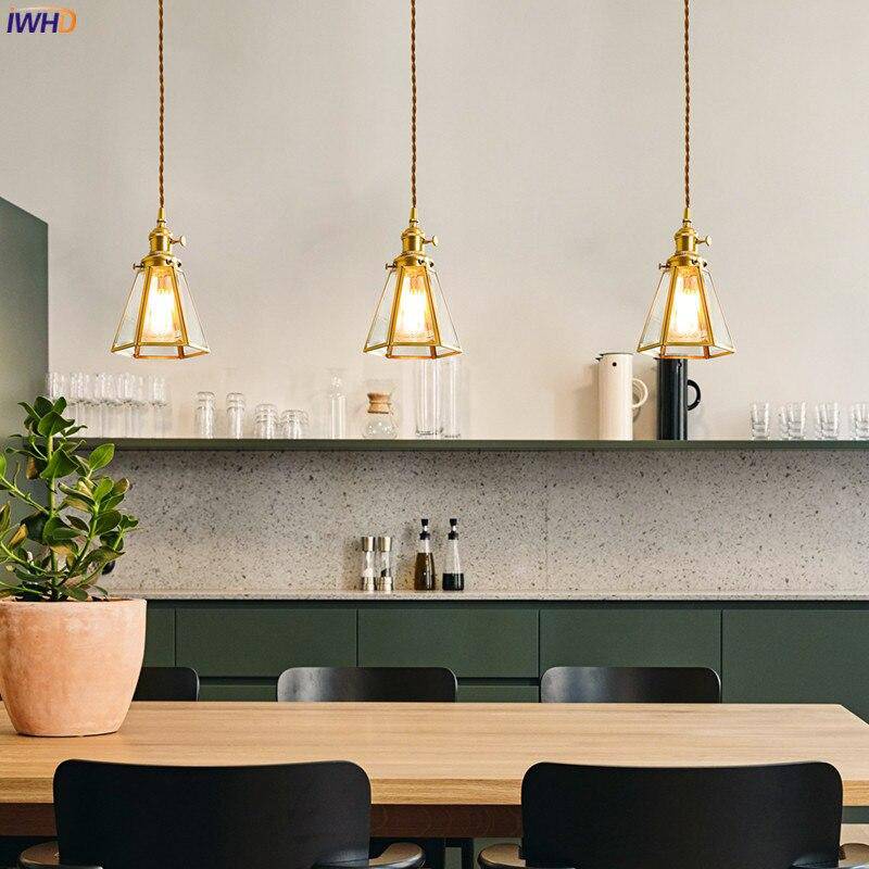 Retro LED pendant light with gold cage and vintage glass