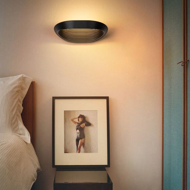 Karina oval and laminated metal design wall light