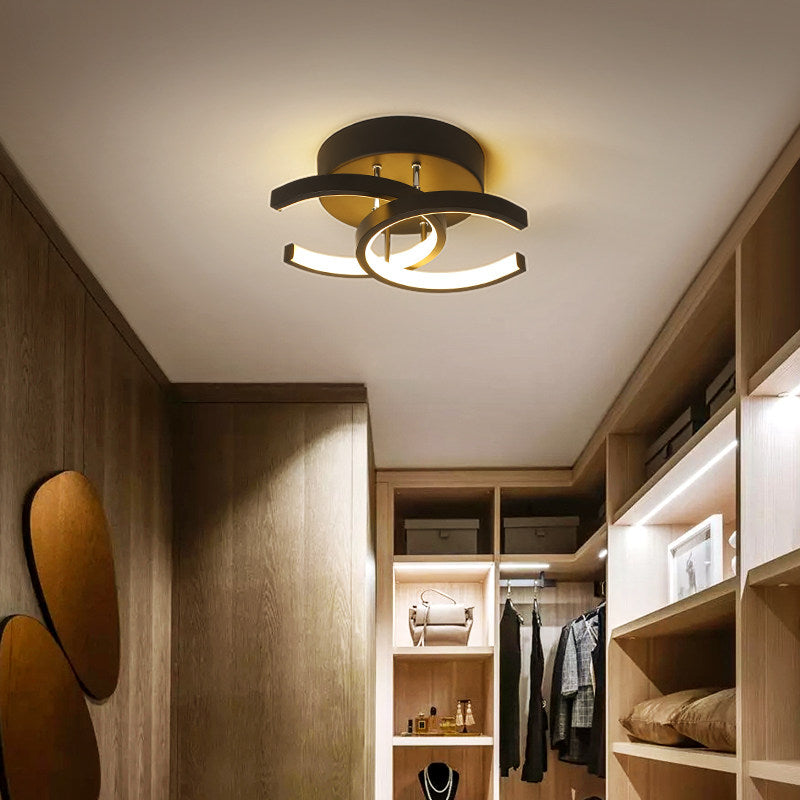 Modern LED ceiling light with two crossed C-shapes in metal Donatelo