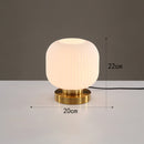 Cylindrical table lamp in coloured glass with gold base Quinn
