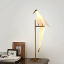 Table lamp shaped like a bird on a golden branch