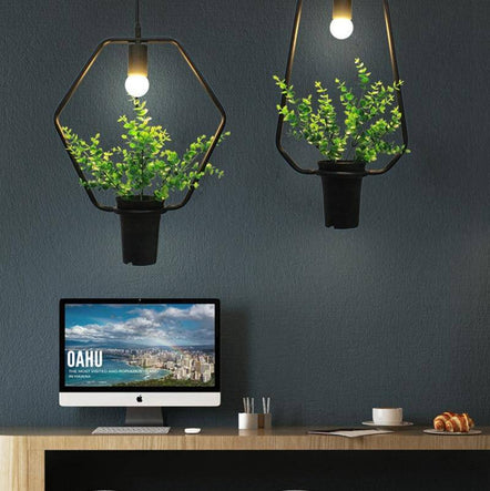 Shape pendant light with green plants trazos