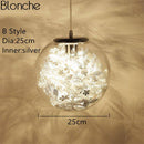 Glass sphere table lamp with leaves