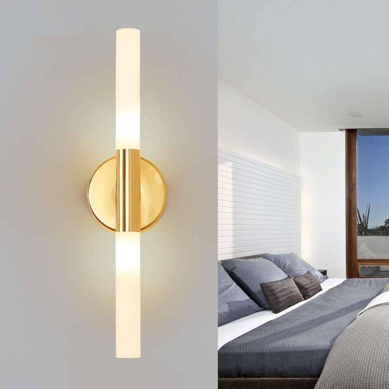 Designer wall light with gold bar and glass LED