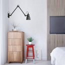 Antique wall light with articulated arm Beside