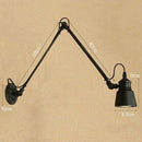 Antique wall light with articulated arm Beside