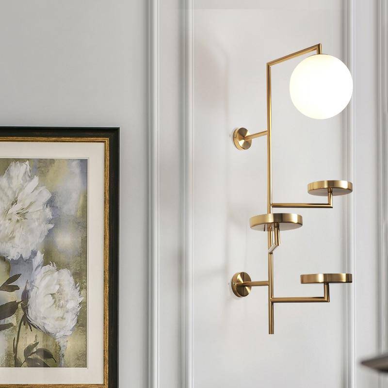 Modern LED wall light with multiple gold discs and glass sphere - vue 4 sur 6