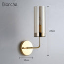 Cylindrical glass wall light with gold base