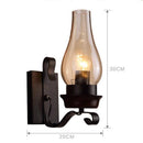 Retro LED metal wall light with candle-style bulb