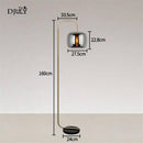 Designer floor lamp with smoked glass globe stone