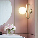 Modern LED wall light with gold ring and glass globe