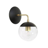 Gold wall light with glass globe arm bean