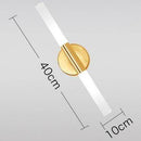 Gold cylindrical LED vanity wall light